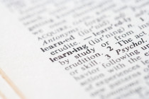 A closeup of a dictionary, with focus on the word: Learning