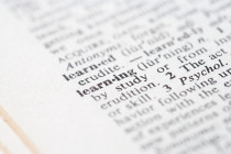 A closeup of a dictionary, with focus on the word: Learning
